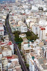View from above of one of central streets and dense residential buildings in the city of...