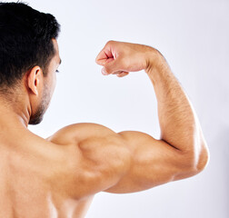 Man, flexing or back muscle for fitness goals, workout or training motivation and healthcare...