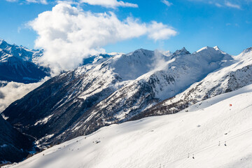 Fototapeta premium View of mountains covered in snow during winter season, Loetschental valley, Switzerland