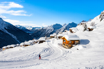 Unidentified man skiing on snowy road during winter season, Loetschental valley, Switzerland