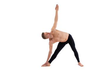 Sports and healthy lifestyle. An attractive man is doing yoga and pilates. White background.