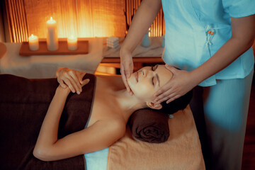 Caucasian woman enjoying relaxing anti-stress head massage and pampering facial beauty skin...