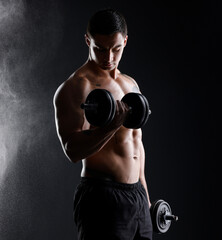 Smoke, bodybuilder or strong man in studio for dumbbell workout, training or exercise for power. Black background, fitness or topless male athlete with weights for arms, sports challenge or wellness