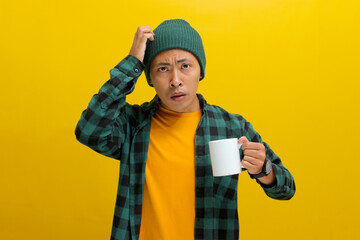Puzzled young Asian man, dressed in a beanie hat and casual shirt, is depicted in a moment of...