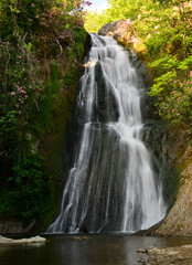 Nebiler Waterfall and Aglayan Cave, located in Dikili, Izmir, Turkey, is a tourist destination with a walking track and picnic area.