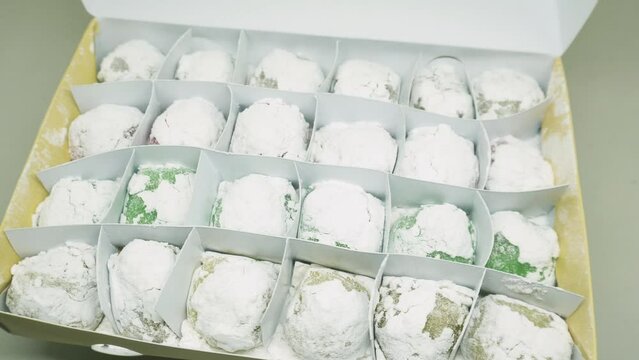 Mochi variants of various colors and flavors such as Pandan, Chocolate, Moca, Milk, Cheese. Mochi is made from sticky rice which is finely ground and then shaped into rounds and flavored