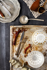 Various old kitchen objects on black chalkboard background