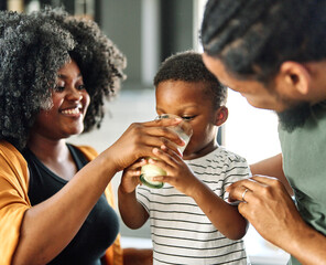 child family kitchen boy son mother father drink breakfast milk healthy drinking food eating glass...