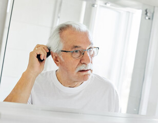 man bathroom combing comb hair care care senior hair hygiene morning skin elderly hairbrush hairstyle skincare beauty portrait healthy vitality active mirror