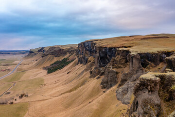 Unrivaled views of Icelandic deep canyon with mountains, volcanic rocks and mountain river. Tourism.