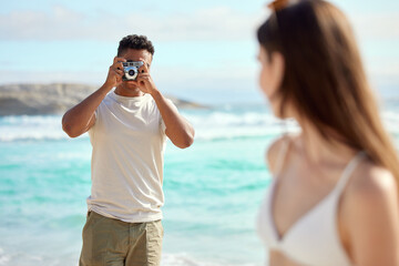 Camera, man and ocean pictures of woman and marriage or love anniversary by sea. Photographer, guy...