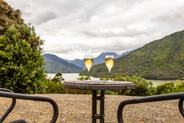 Two wine glasses on the table, Marlborough Sounds, South Island, New Zealand, Oceania.