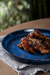 Crispy chicken wings in teriyaki sauce