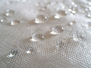 Water droplets on a white cloth.