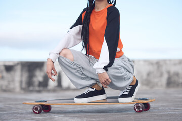 Hip hop, fashion and woman on skateboard outdoor for freedom with streetwear, style inspiration and...