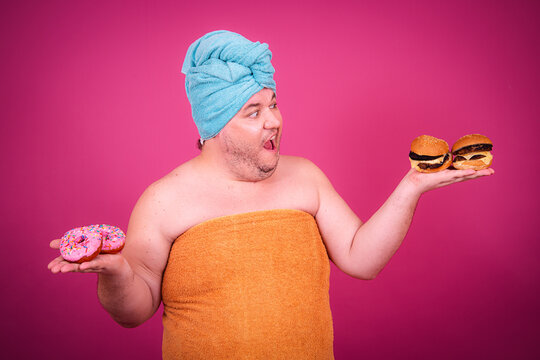 Early morning and preparation for the party. Funny fat man after a shower.