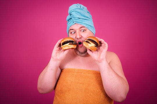 Early morning and preparation for the party. Funny fat man after a shower.