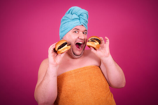 Early morning and preparation for the party. Funny fat man after a shower.