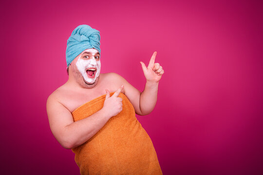 Early morning and preparation for the party. Funny fat man after a shower.