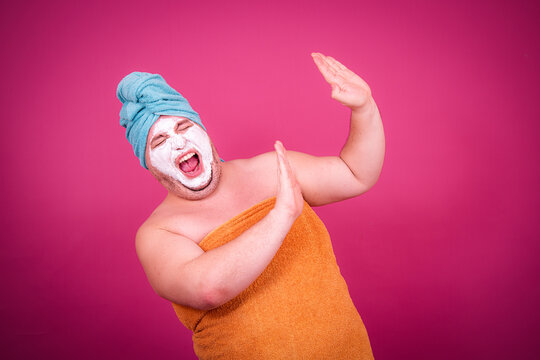 Early morning and preparation for the party. Funny fat man after a shower.