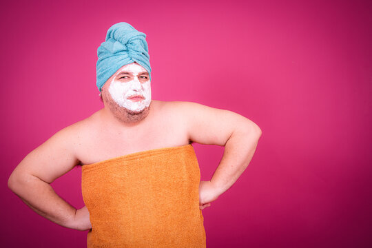 Early morning and preparation for the party. Funny fat man after a shower.