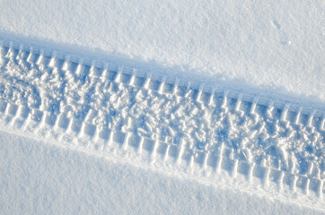 Wheel tracks on the snow.