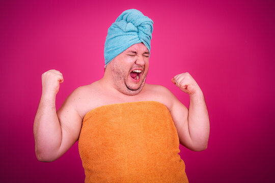 Early morning and preparation for the party. Funny fat man after a shower.