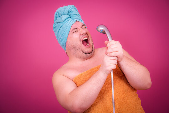 Early morning and preparation for the party. Funny fat man after a shower.
