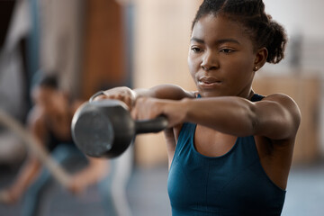 Black woman, fitness and training with kettlebell in gym for muscle, wellness or body health...