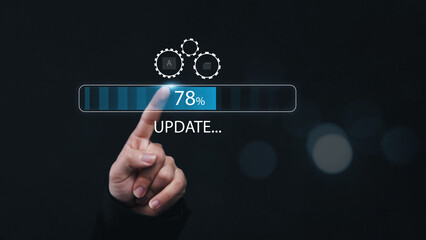 Installing update system software for device operating systems to be up to date with the new version. Graphics icon showing updating function screen loading on computer, with businessman working.
