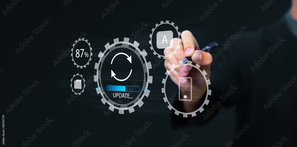 Fototapete Updating computer system software application installation for devices to be up to date with the new version. Hand interacting with graphics icon updating function screen loading on computer laptop.