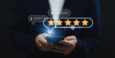 Businessman using smartphone giving online customer reviews giving stars evaluating product shop,...