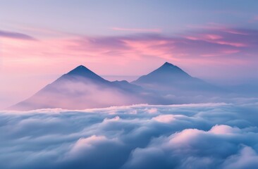 Photograph of two mountain peaks emerging from the clouds 