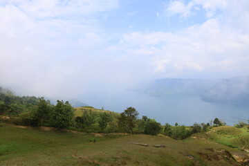 Stunning scenery of volcanic lake Toba - largest and deepest crater lake in the world located in North Sumatra, Indonesia