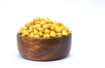 Roasted Garbanzo Bean or Chickpea in a Wooden Bowl Isolated on White Background with Copy Space, Also Known as Bengal Gram or Egyptian Pea