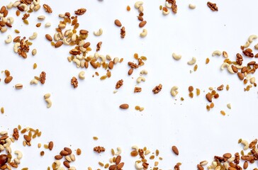 Top View of Walnut, Pistachio, Cashew, Almond, Raisin, Palm Date and Peanut Dry Fruits on White Background with Copy Space, Healthy Eating Food Concept