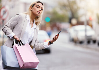 Mobile, shopping and woman waiting for taxi in city for internet deal, search bargain or sale...