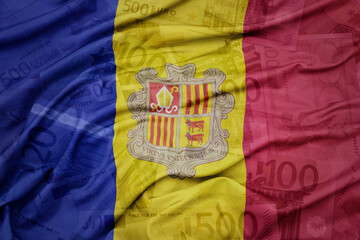 waving colorful national flag of andorra on a euro money banknotes background. finance concept. .