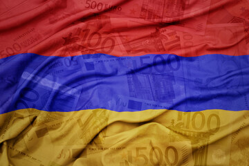 waving colorful national flag of armenia on a euro money banknotes background. finance concept.
