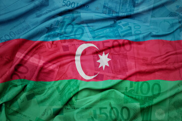 waving colorful national flag of azerbaijan on a euro money banknotes background. finance concept.