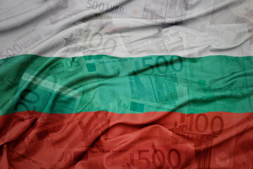 waving colorful national flag of bulgaria on a euro money banknotes background. finance concept.