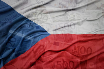 waving colorful national flag of czech republic on a euro money banknotes background. finance concept.