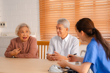 Senior Woman Receives Medical Advice and Treatment from a Doctor in a Hospital: Health Care Professionals Provide Help and Care to Elderly Patients with Insurance in a Clinical Setting