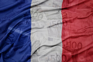 waving colorful national flag of france on a euro money banknotes background. finance concept.