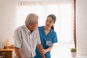 Senior Woman Receives Medical Advice and Treatment from a Doctor in a Hospital: Health Care Professionals Provide Help and Care to Elderly Patients with Insurance in a Clinical Setting