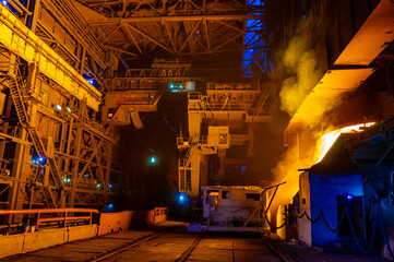 Iron works in a metallurgical plant at night. Industrial background