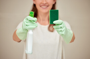 Obraz premium Woman, cleaning and sponge with spray in studio, biodegradable product and disinfectant liquid in bottle for hygiene. Bacteria, rubber gloves and detergent supplies, house maintenance with cleaner