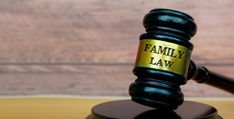 Family law text engraved on lawyer's gavel. Legal and law concept.