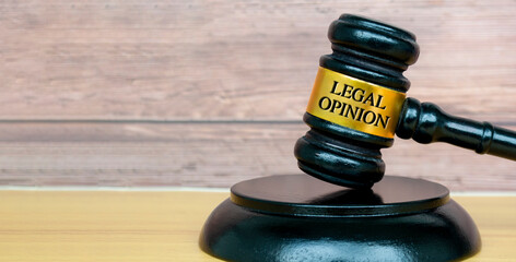 Legal opinion text engraved on lawyer's gavel. Legal and law concept