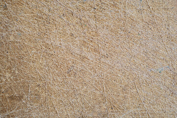 
Fiberboard, cut with a knife during work, as an abstract background.